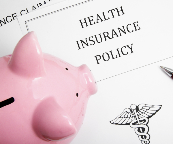 a health insurance policy and a piggy bank