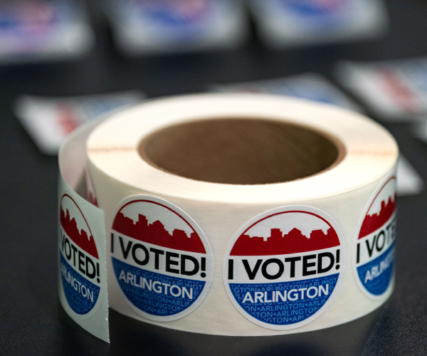 a roll of i voted stickers indicating the city of arlington virginia