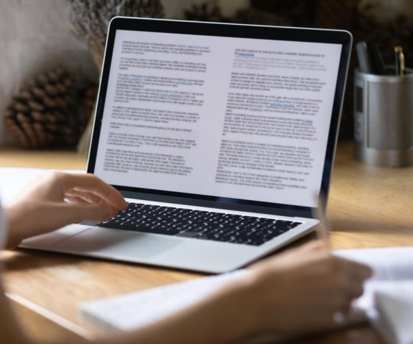 person reading health news on laptop