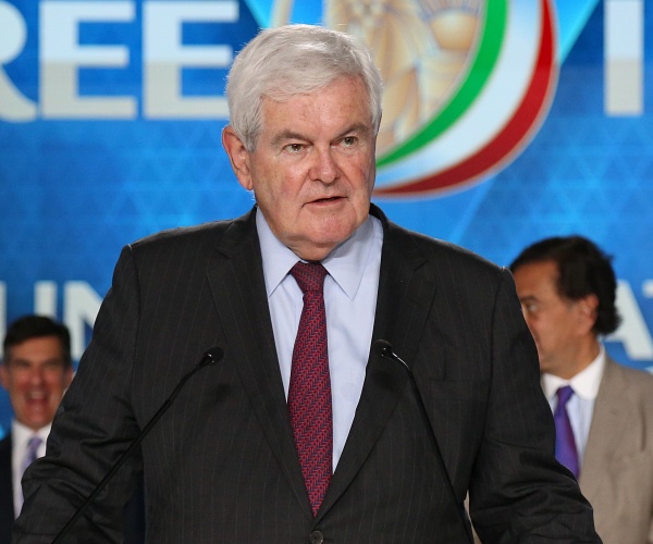 newt gingrich speaks into mics