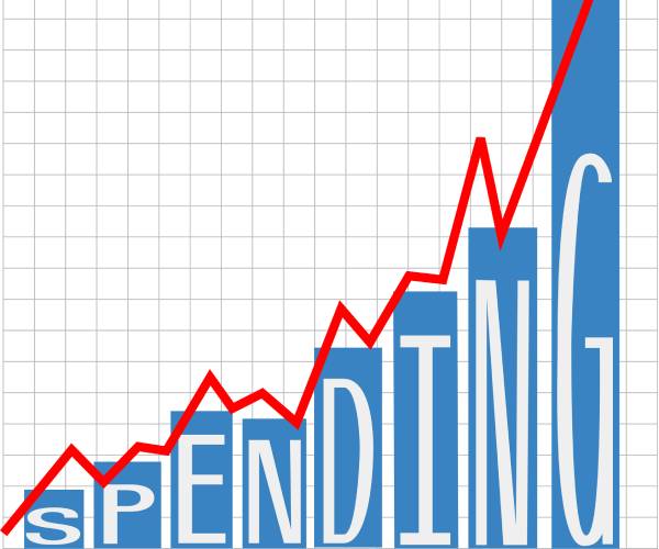 a chart with the word spending and a graph rising higher and higher