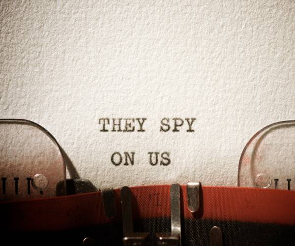 a piece of paper in a typewriter with the words they spy on us typed on it