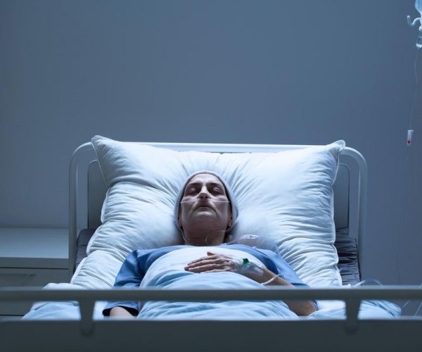 woman in bed in hospital