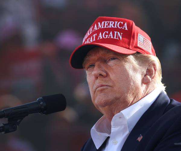 donald trump in maga hat