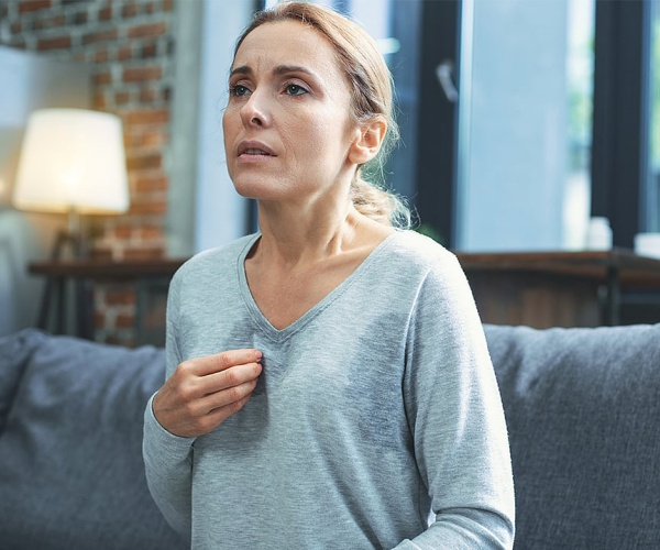 woman sweating from menopausal hot flash