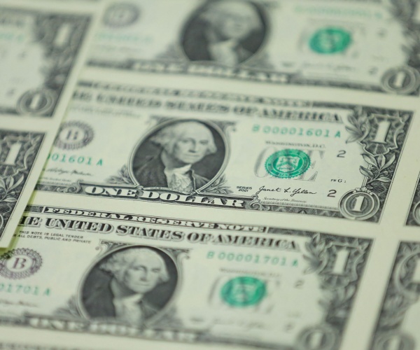 stacks of one dollar bills displayed