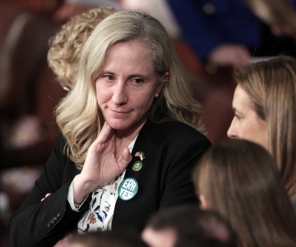 Abigail Spanberger looks at colleagues 