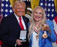 Olympian Humphries Gives Trump Order of Ikkos Medal